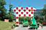 The Panach' advertising caravan passes under the polka dot jersey (365x)