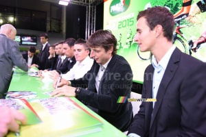 The riders take some time for a signing session (418x)