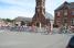 The peloton passes in front of the town hall and the church of Montay (616x)
