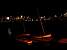 Little boats in front of Boston by night (102x)