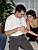 Vincent unwraps a present and Virginie is watching him closely (573x)
