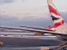 The tail end of the British Airways plane next to us (311x)
