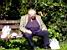A sleaping man on a bench in a park in Bristol (775x)