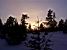 Le coucher du soleil dans un paysage hivernal (152x)