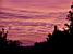 The overhead wire for the train in front of a colourful sky (172x)