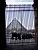 Pyramid of the Louvre seen through a gate (273x)