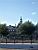 Houses next to the canal with the 'Lange Jan' tower behind them (291x)
