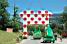 The Panach' advertising caravan passes under the polka dot jersey (337x)