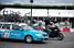 A Bouygues Telecom rider next to the team car (360x)