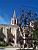 Avignon: a church with a work of art in front of it (metal cages with wine plants in it) (377x)
