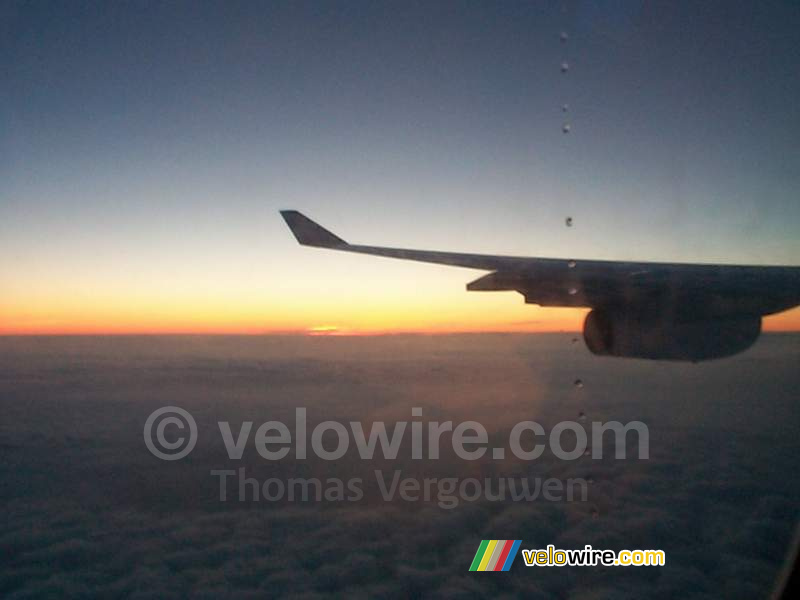 [Boston] - The sun above the clouds in the plane