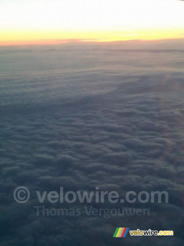 [Boston] - Sun and clouds seen from the airplane