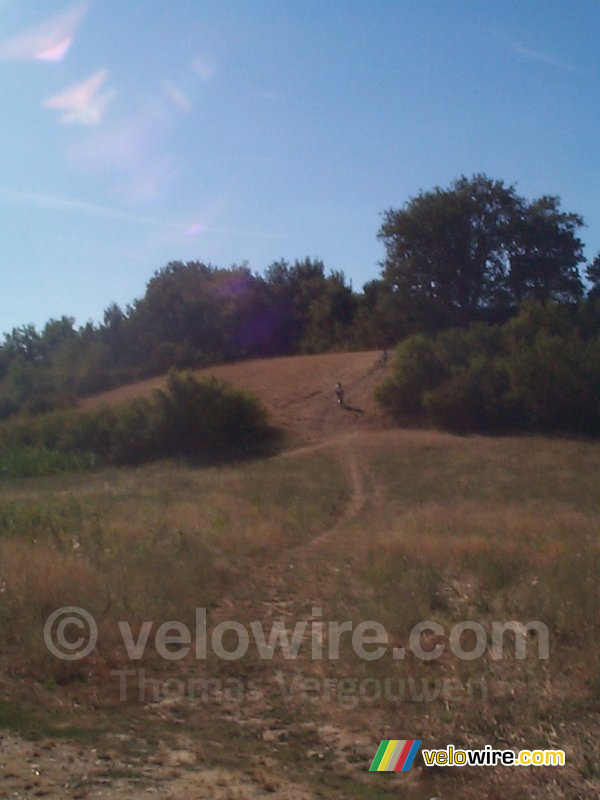 Cédric coming down on his bike