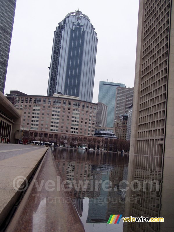 One of the skyscrapers in Boston with a mirror effect in the water on the foreground