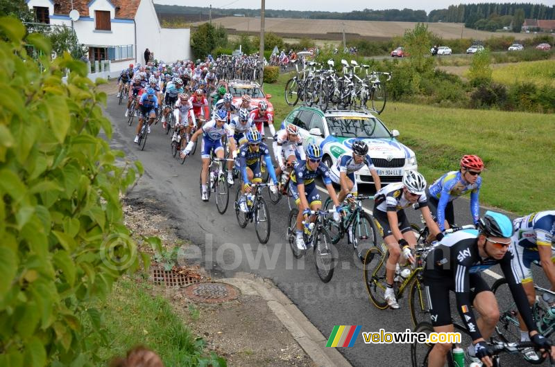 The peloton taken over by some cars