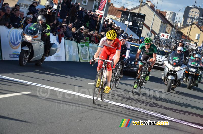 The breakaway crossing the finish line for the first time