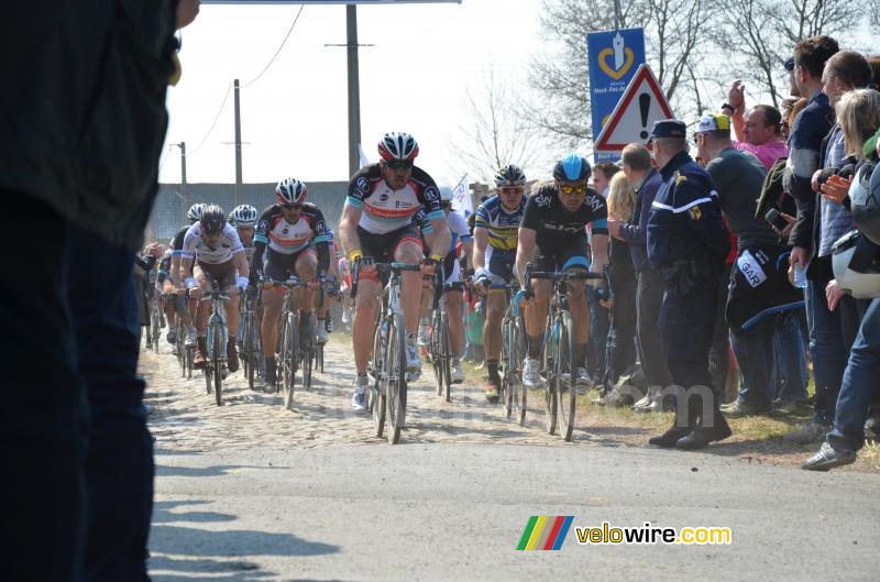 The peloton leaving cobble section 14