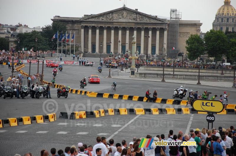 Richie Porte (Team Sky) crosses solo in front of the Assemblee Nationale