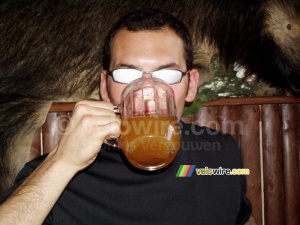 Cédric drinking a glass of warm beer (184x)