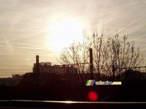 Rising sun above the trees and the railway (320x)