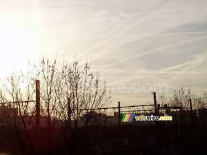 Rising sun above the trees and the railway (373x)