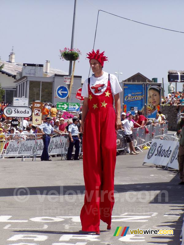 La Vache Qui Rit man on stilts