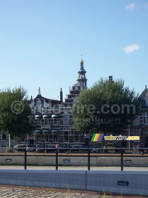 Houses next to the canal with the 'Lange Jan' tower behind them (228x)
