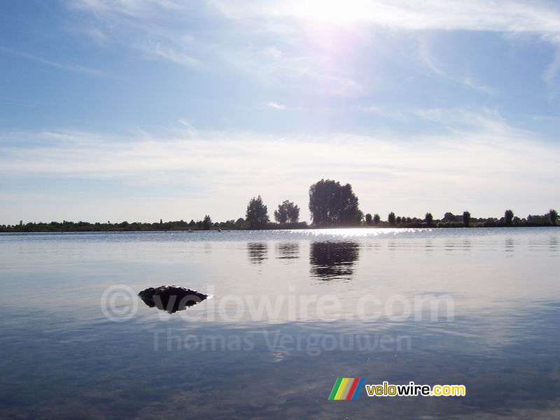 The bright sun above the lake