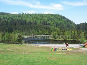 A lake in the middle of the forest and a ski lift (366x)