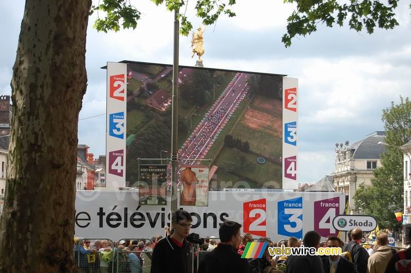 The riders on the big screen at the finish in Gent