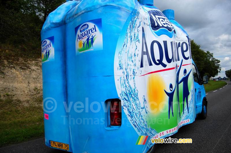 A pack of Nestlé Aquarel water bottles in the advertising caravan