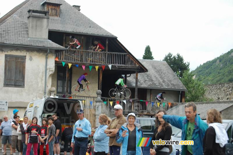 A decorated house with cyclists