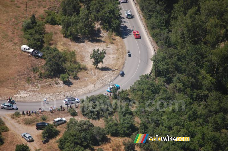 Some Tour cars and a delayed Bouygues Telecom rider