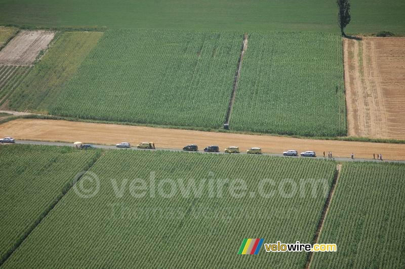 The cars are waiting for us next to a grain field (1)