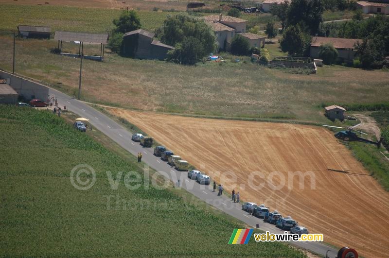 The cars are waiting for us next to a grain field (2)